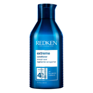 Bottiglia blu di balsamo redken 